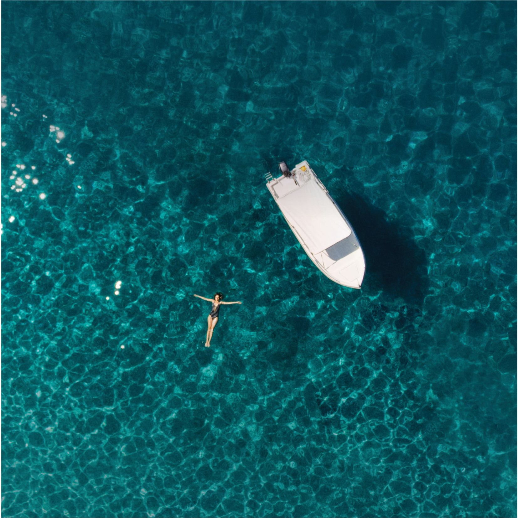 Girl and boat floating on water