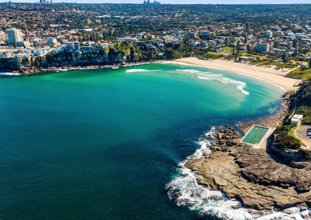 Aerial view of beach with bright blue water